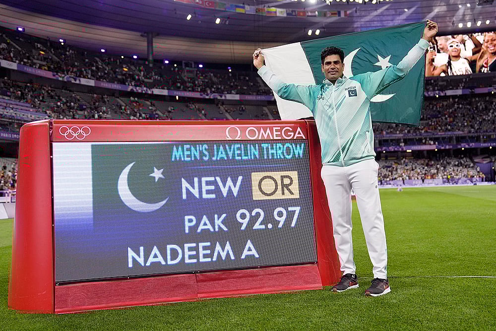 | Photo: AP/Matthias Schrader : Arshad Nadeem, of Pakistan, celebrates after winning gold in men's javelin throw final 